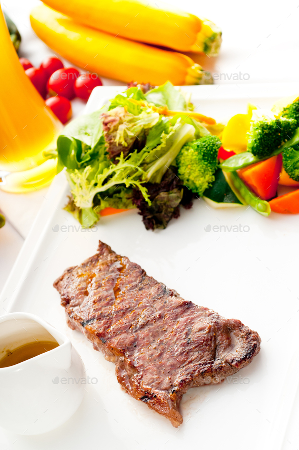 juicy BBQ grilled rib eye ,ribeye steak and vegetables Stock Photo by